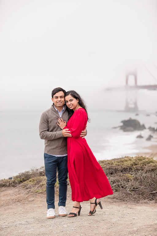 couples’ portrait in front of a foggy ocean