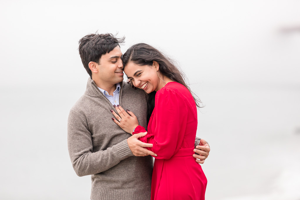candid engagement photo in red dress