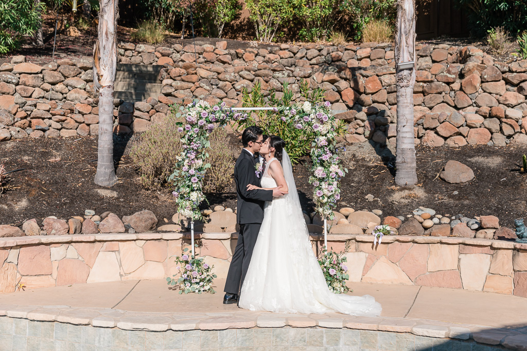 first kiss in backyard ceremony in San Ramon