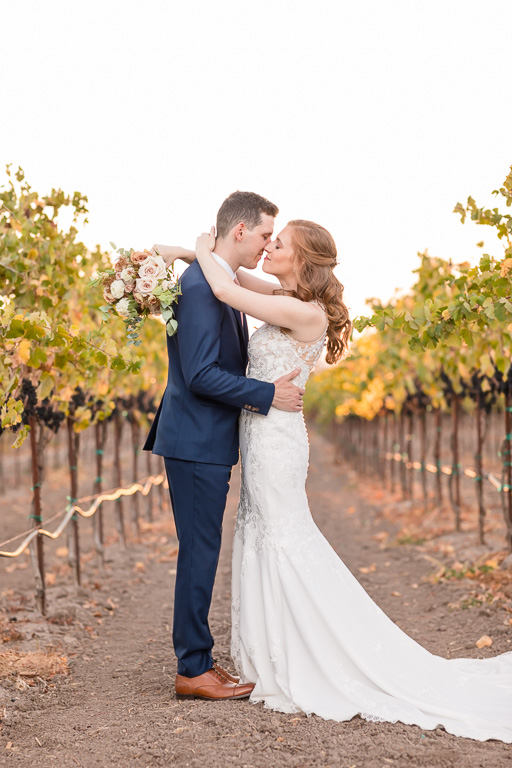wedding photo of bride and groom in vineyards at Viansa Sonoma