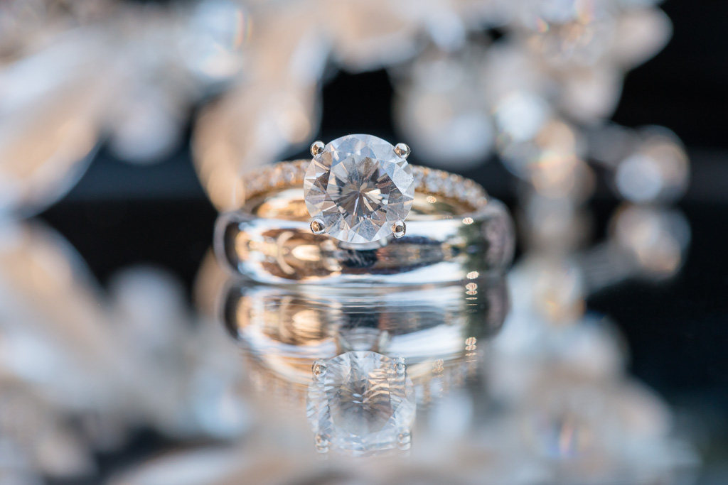 macro photo of wedding and engagement ring on wedding day