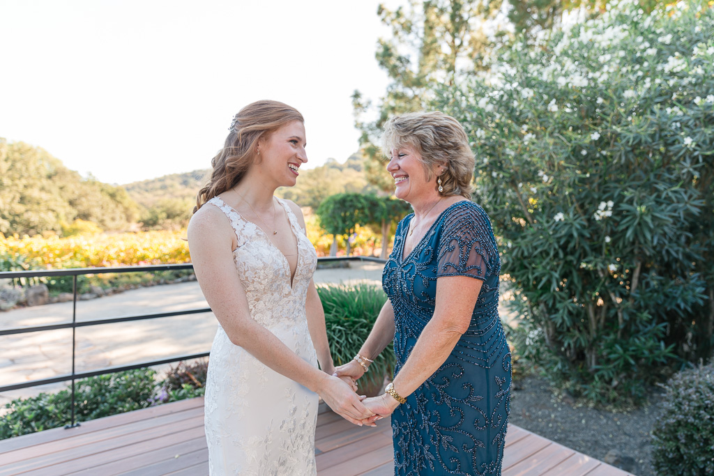 moment between bride and her mother before wedding