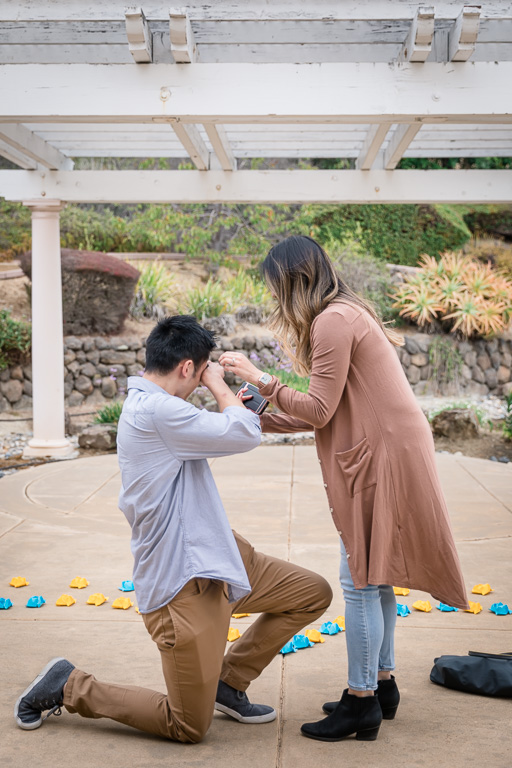 guy wiping off tears during proposal