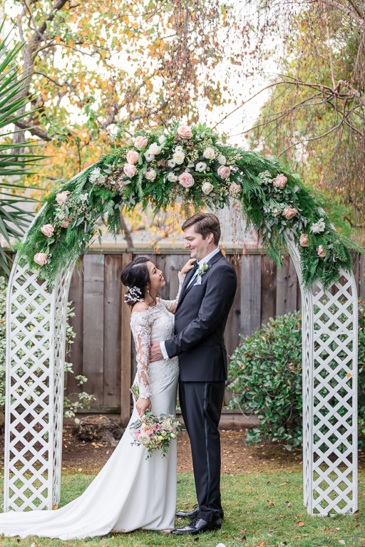 newlywed weddnig portraits in backyard after wedding ceremony