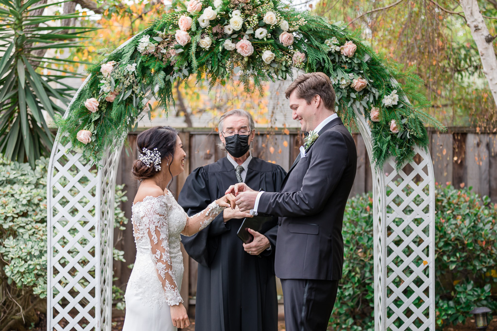 wedding ring exchange during backyard wedding