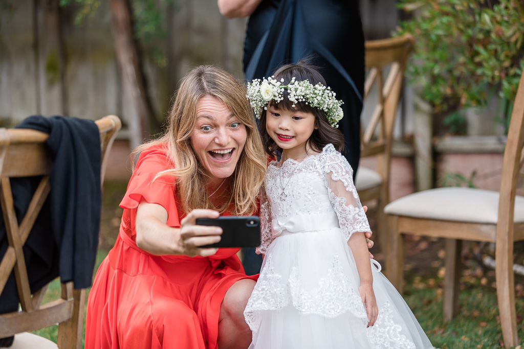 taking a selfie with the flower girl