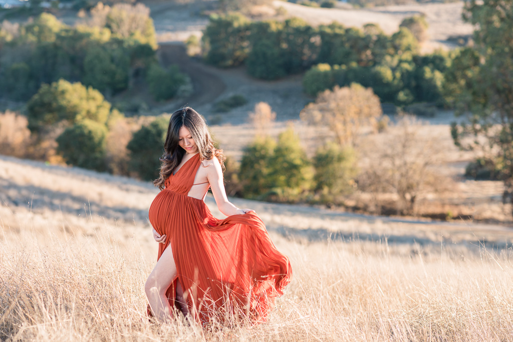 golden hour maternity photos with a sheer dress