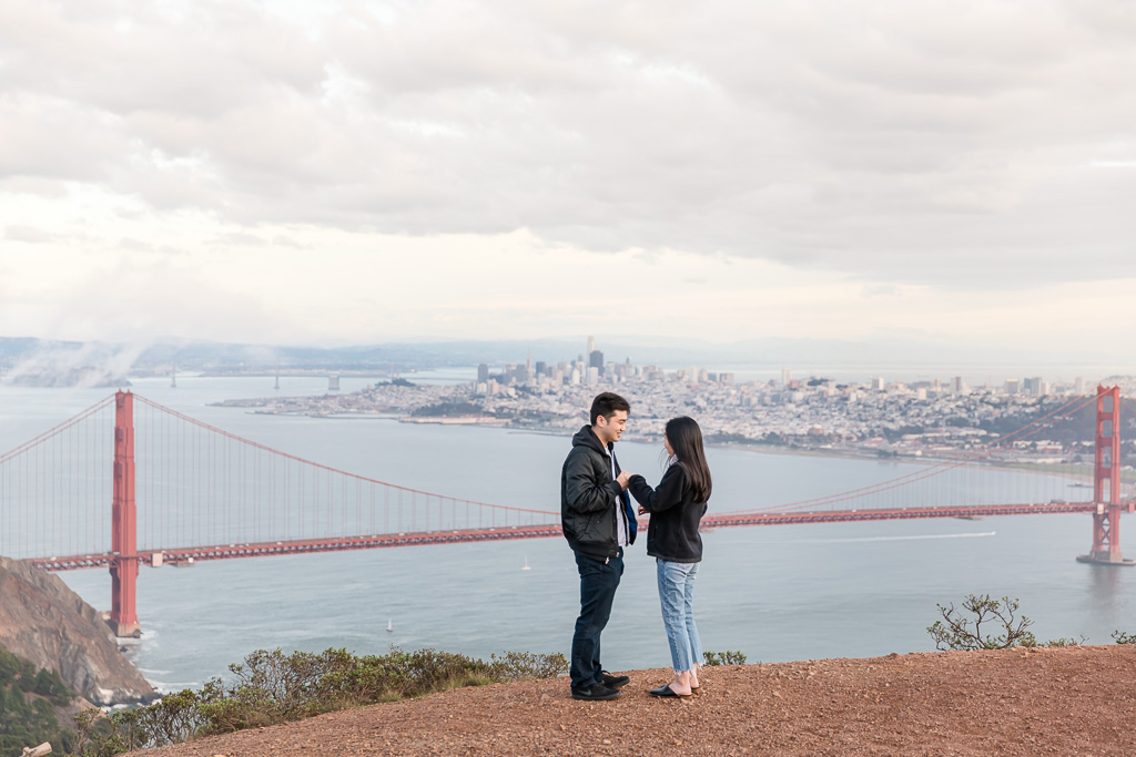 Hawk Hill surprise engagement proposal in front of Golden Gate Bridge