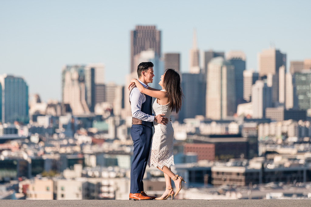 engagement shoot in front of San Francisco skyline