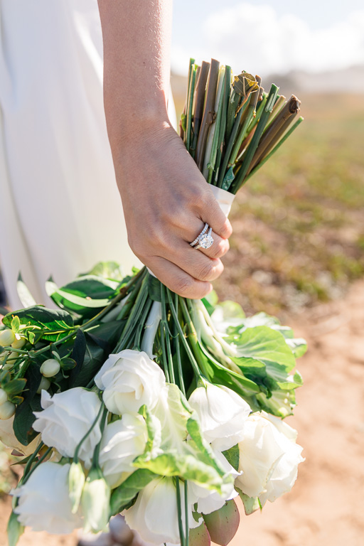 close-up photo of wedding ring and bouquet