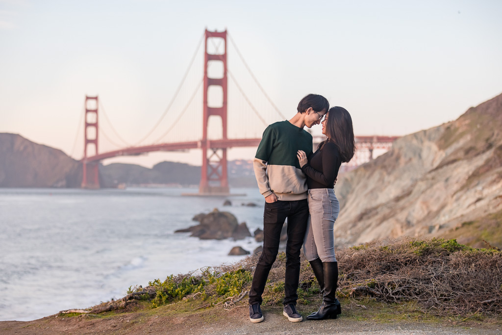 San Francisco coastside engagement photos with Golden Gate Bridge background