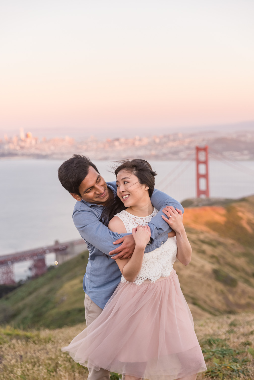 beautiful golden sunset save-the-date engagement portrait on top of San Francisco