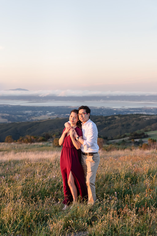 couple portrait with the Bay in the background
