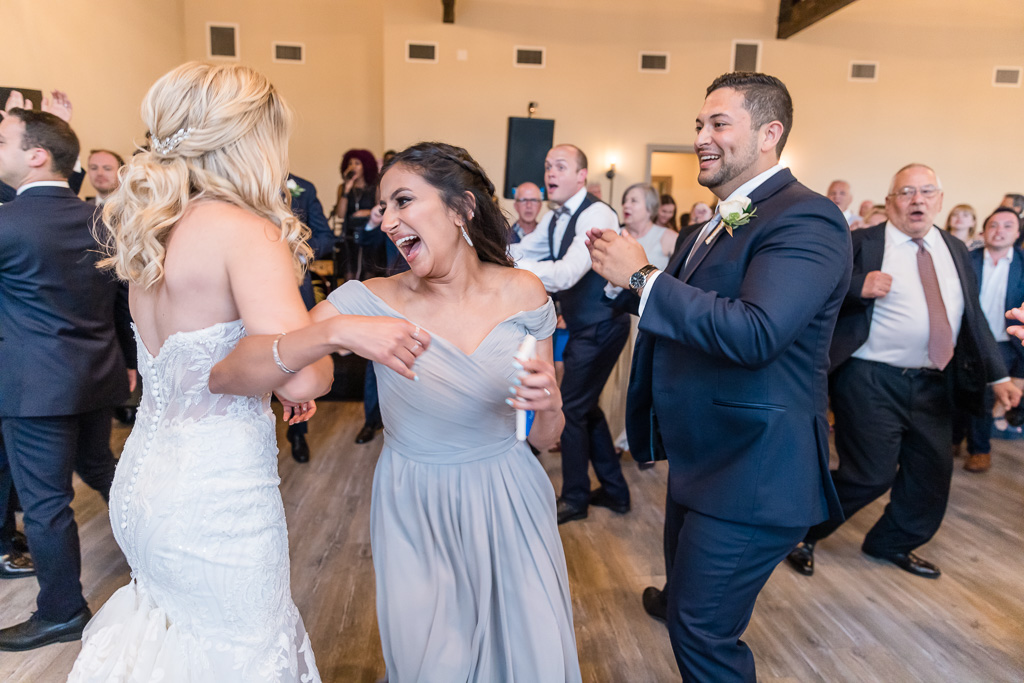 bride dancing with a bridesmaid