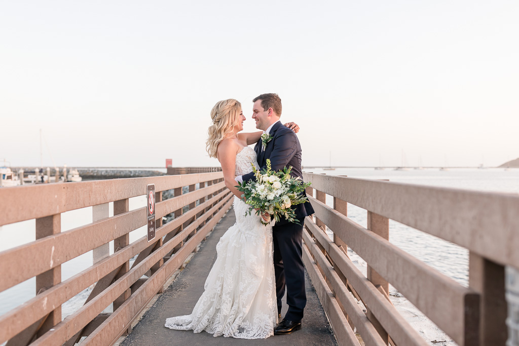 bride and groom on the pier in Half Moon Bay