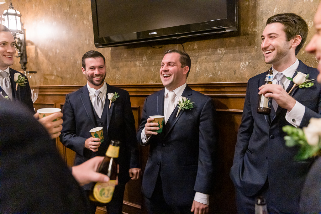 the guys enjoynig some drinks before wedding