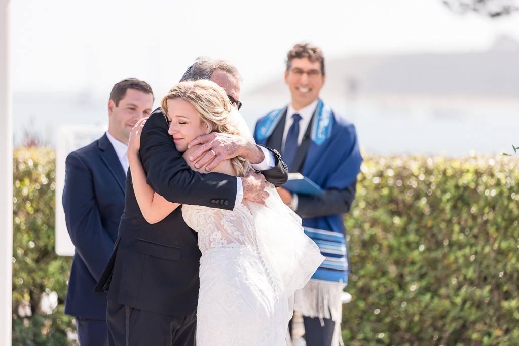 bride giving father a hug