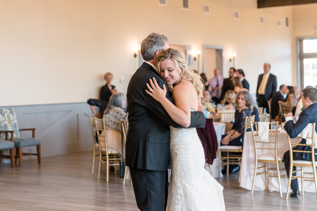 bride sharing a moment with father after father/daughter dance