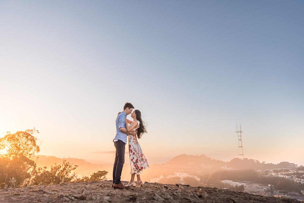 epic engagement photo during sunset with Sutro Tower in the background