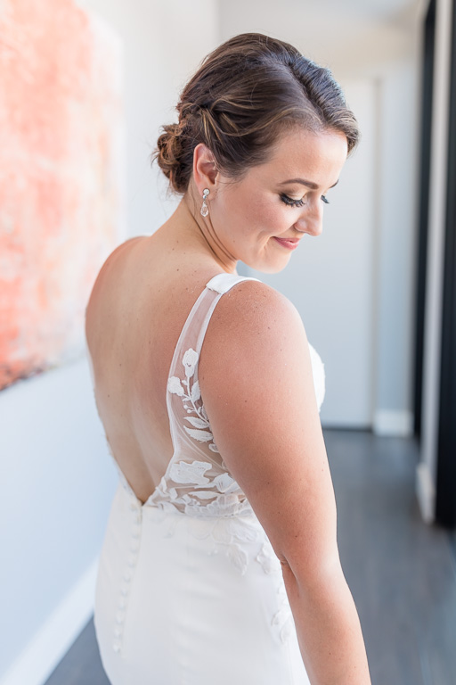 bride looking elegant in a long hallway