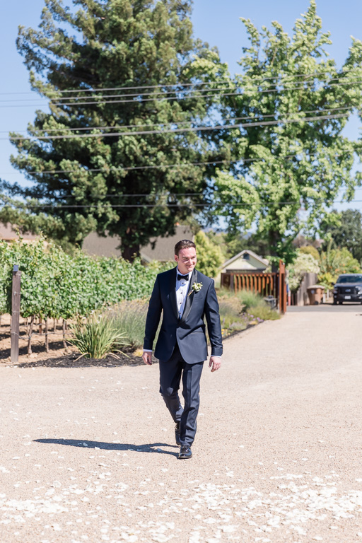 groom walking into wedding ceremony