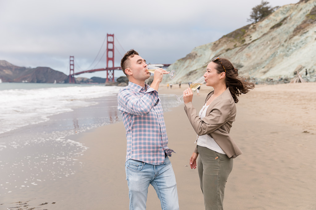 couple sharing a glass of champagne at the Golden Gate Bridge view
