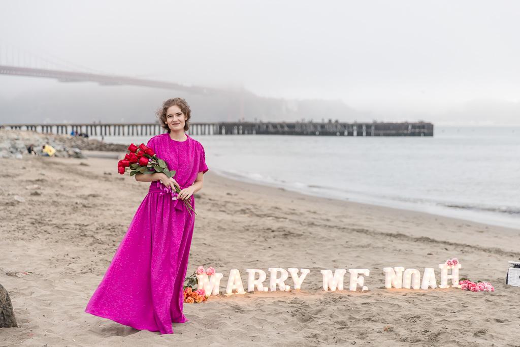 battery-powered light-up LED “marry me” letters on beach