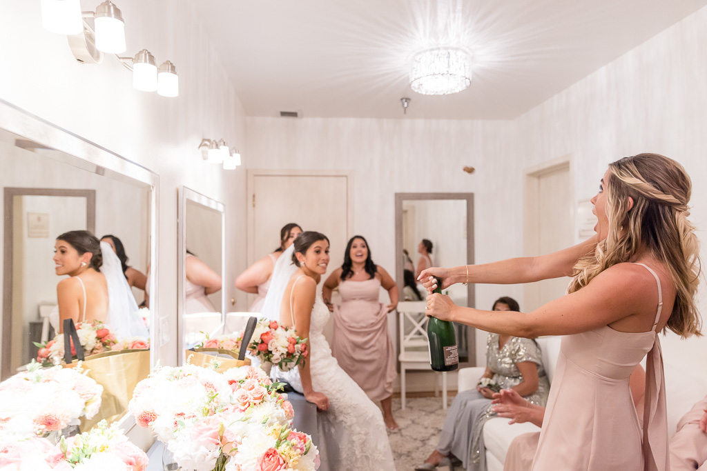 champagne cork flying in bridal room after uncorking