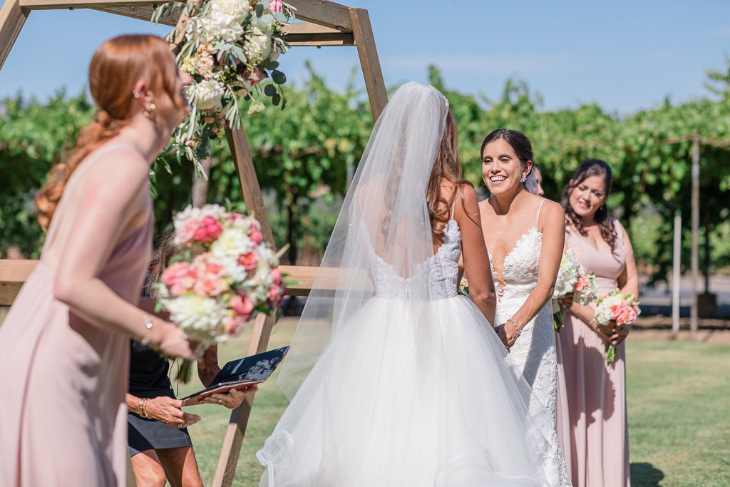 brides laughing during the ceremony