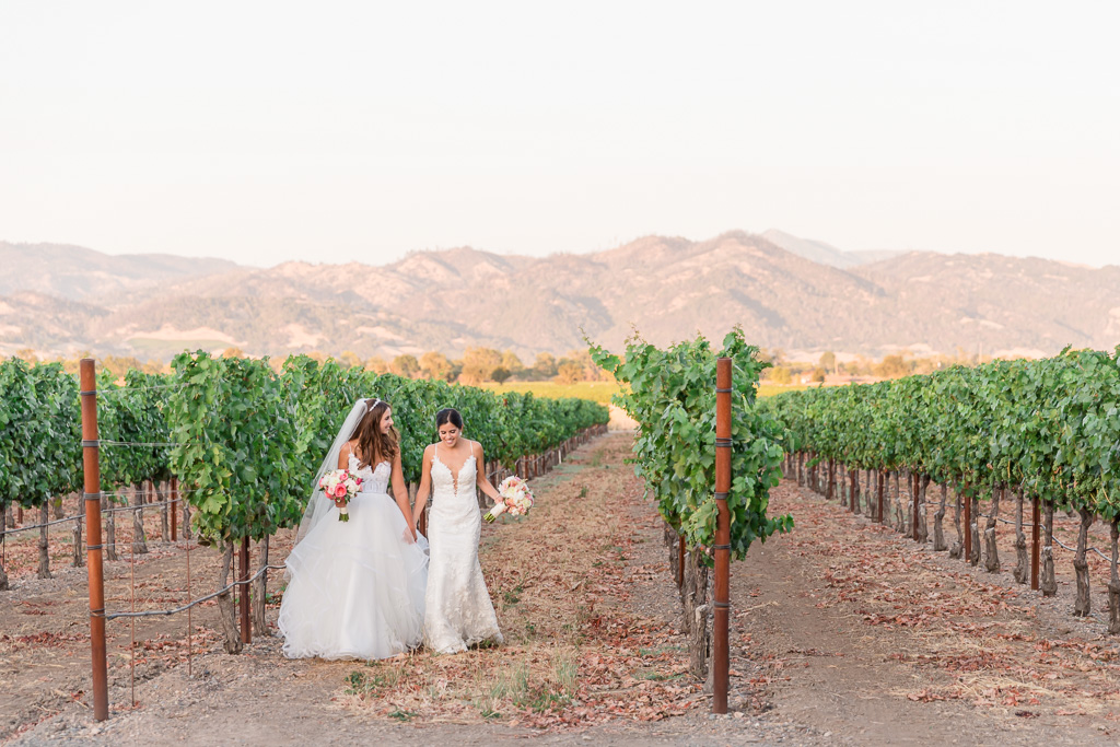 bride and bride in the Trentadue Winery vineyards at sunset