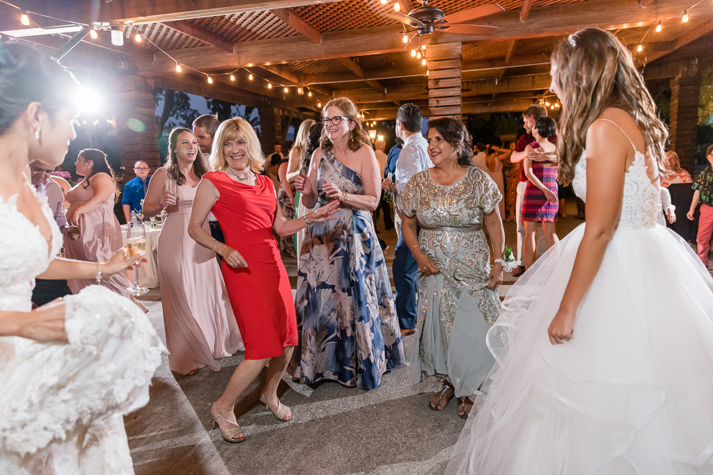 brides enjoying their time at the reception