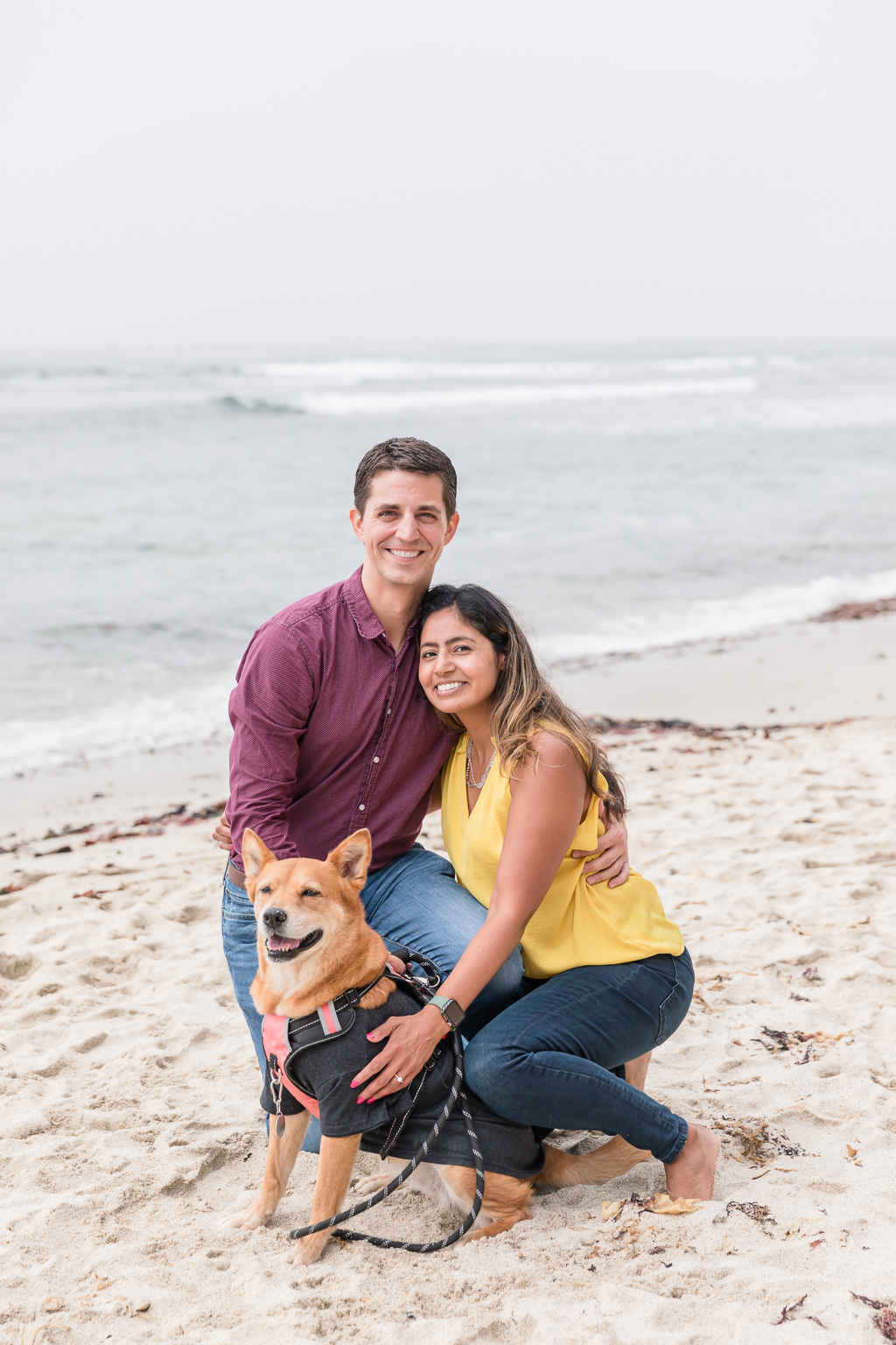 family photo of couple and their dog at Moss Beach