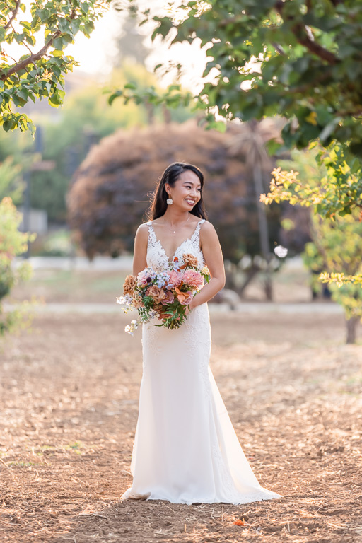 bridal portrait in sunny orchard