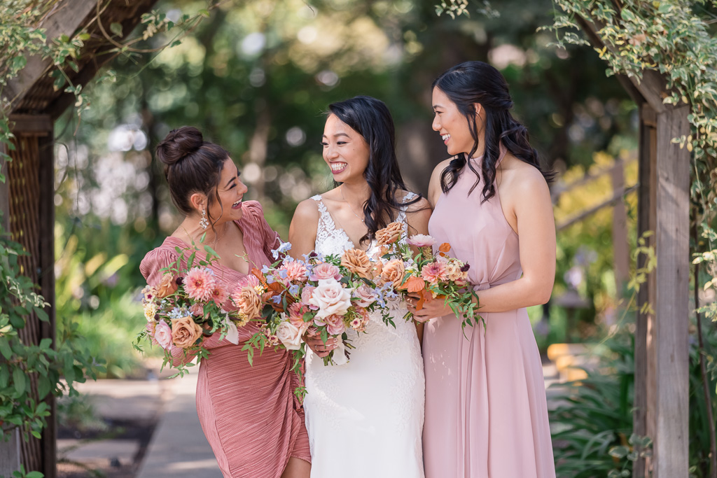bride with a couple of her bridesmaids