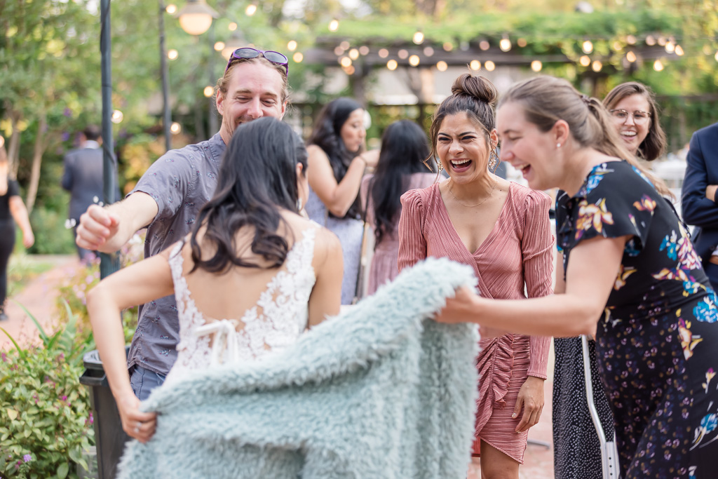 bride mingling with guests during cocktail hour