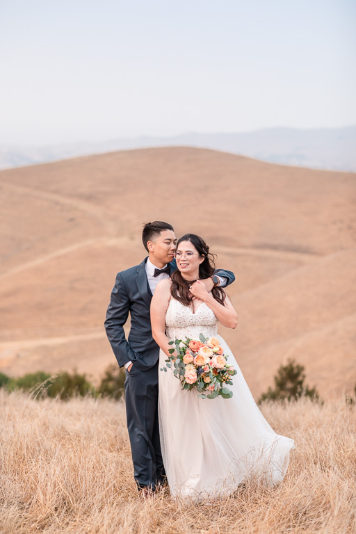 bride and groom portraits on the rolling hills at Nella Terra in Sunol