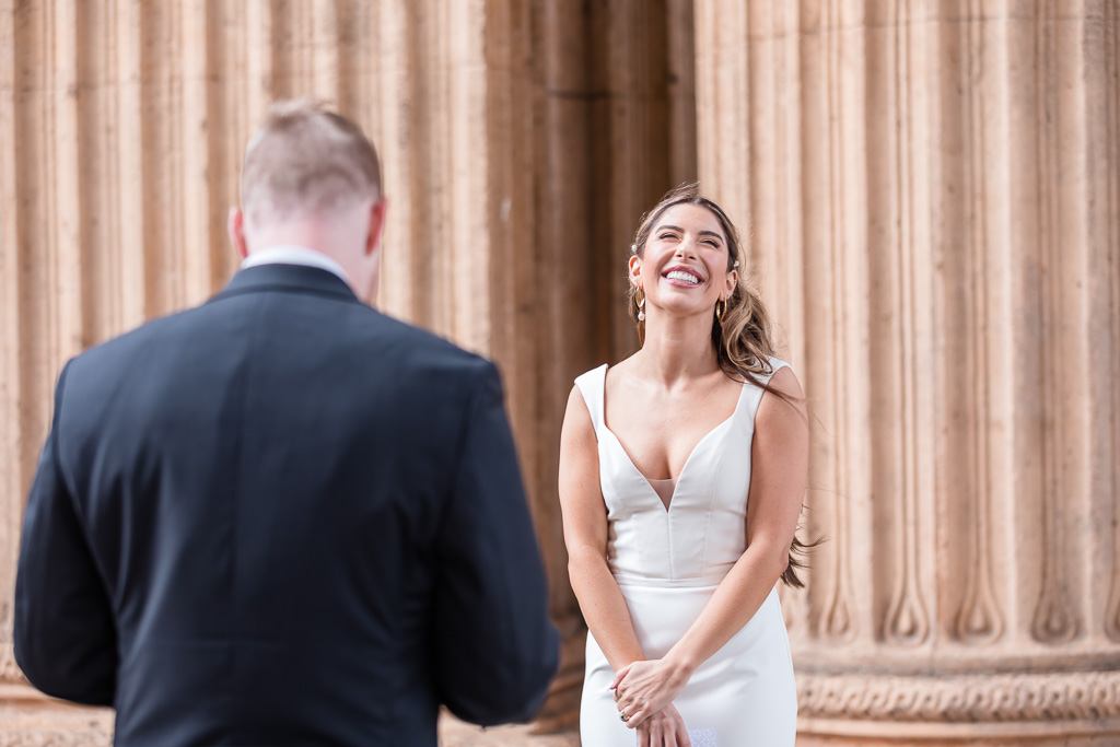bride laughing during Palace of Fine Arts wedding ceremony