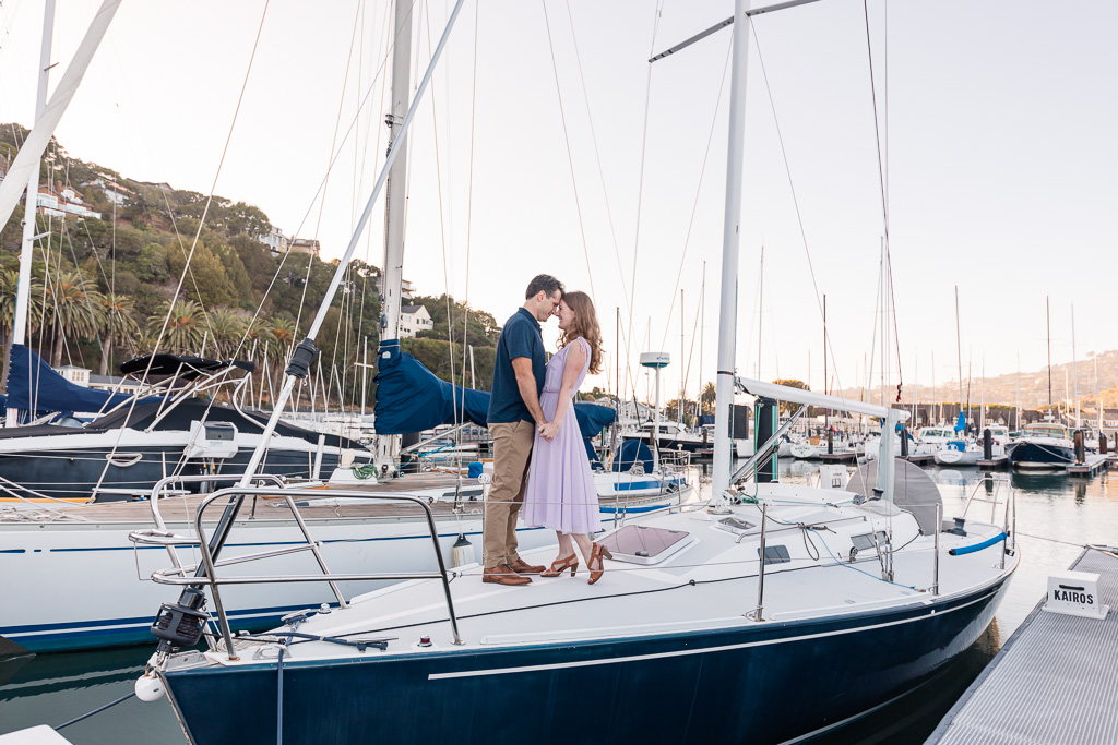 engagement photos on a boat in the marina