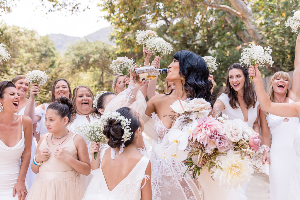 bride drinking whiskey with her girls