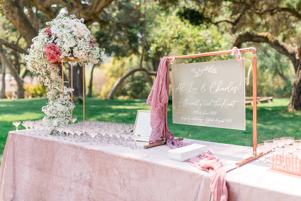 blush themed wedding sign-in table