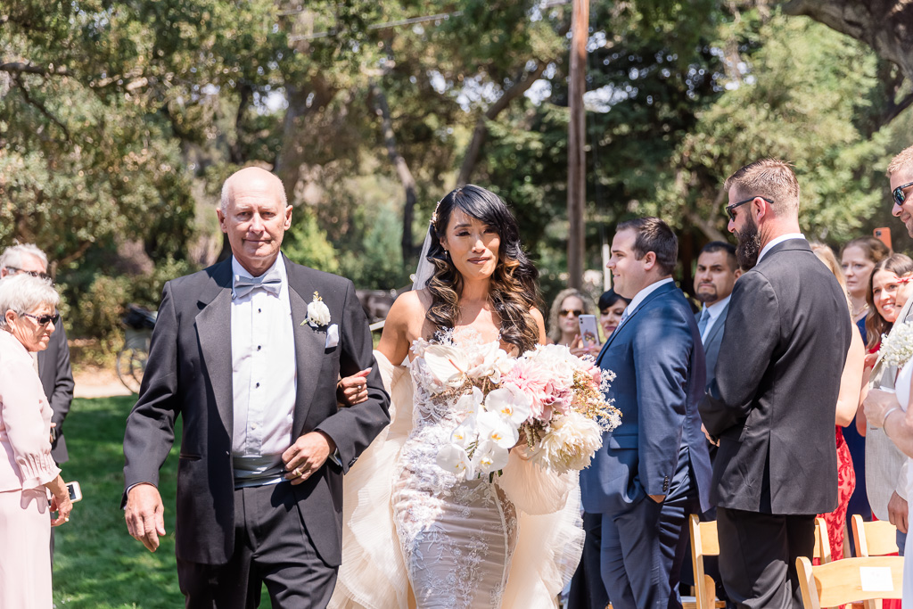 bride got emotional when walking down the aisle with her father