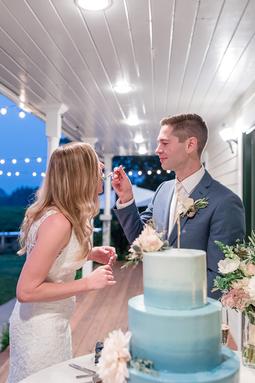 groom feeding cake to the bride