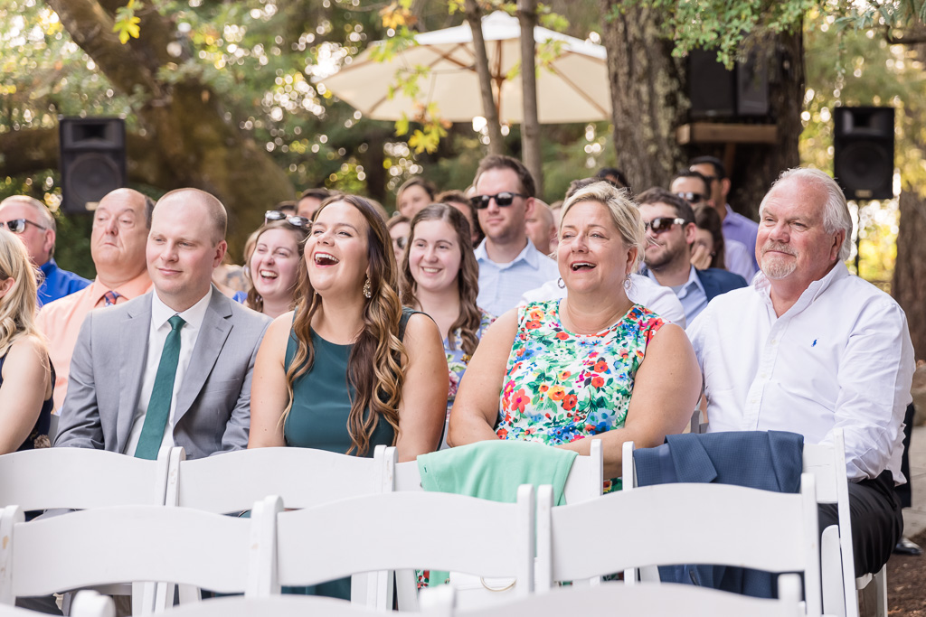 guests laughing during ceremony