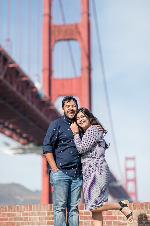 happy couple under Golden Gate Bridge