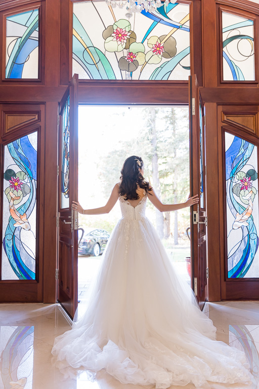 glowing bride looking out front door