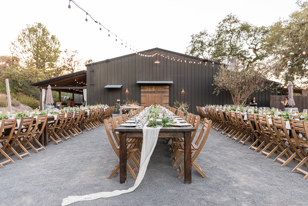 long wooden reception tables at The Highlands Estate