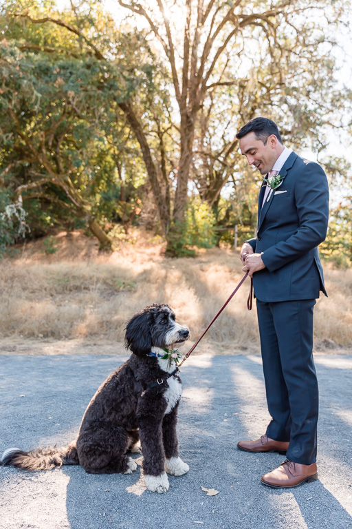 photo of groom with dog