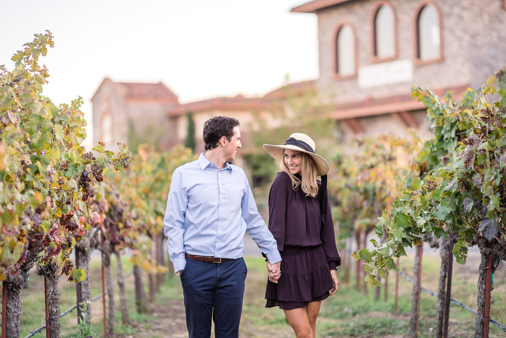 flirty playful engagement session at Ruby Hill Winery vineyards