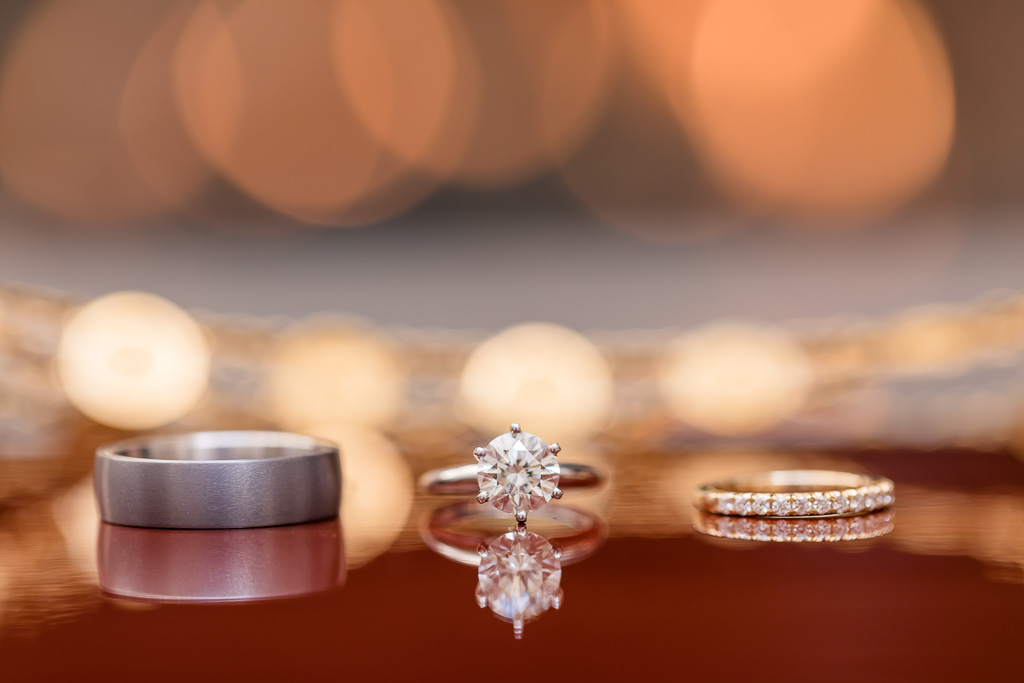 wedding ring photo with warm glow bokeh