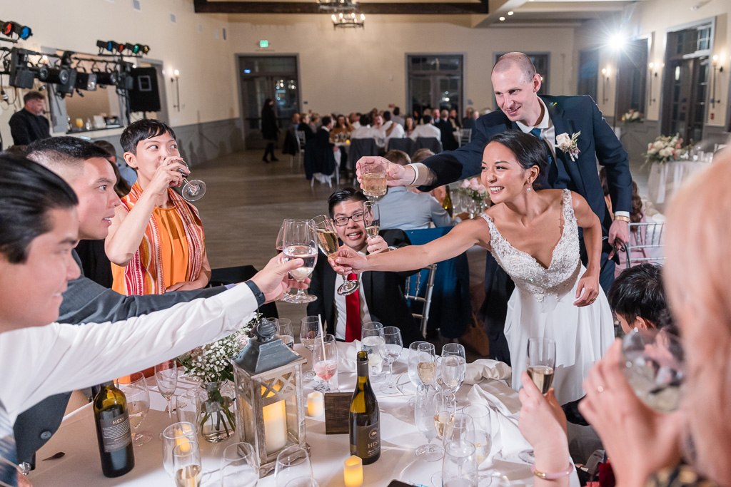 bride and groom sharing a drink with guests